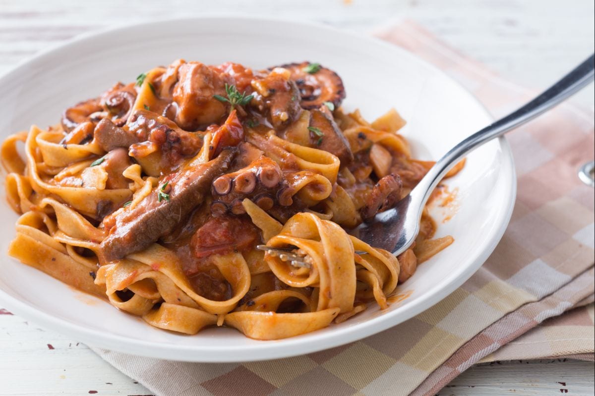 Fettuccine pasta with octopus and porcini mushroom sauce