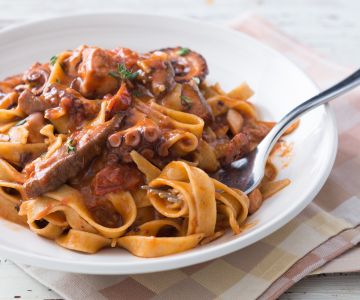 Fettuccine pasta with octopus and porcini mushroom sauce