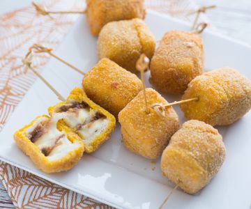 Fried mozzarella and anchovy skewers