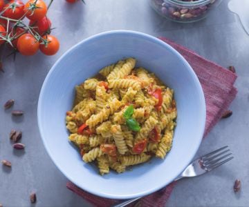 Fusilli pasta with pistachio pesto and cherry tomatoes