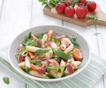 Pasta with stracchino cheese, bresaola, and cherry tomatoes