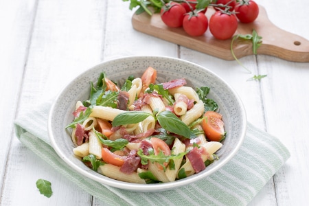 Pasta with stracchino cheese, bresaola, and cherry tomatoes