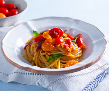 Pasta with cherry tomatoes anchovies and onion