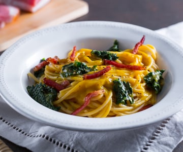 Pasta with delicata squash cream and black cabbage