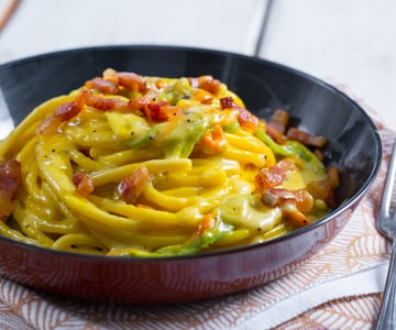 Bucatini with zucchini flowers, guanciale and saffron