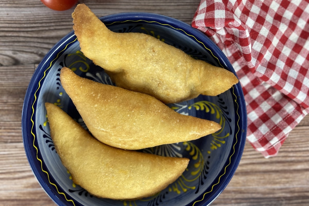 Panzerotti filled with spicy salami, mozzarella and tomato sauce