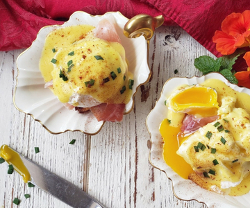 Eggs Benedict with passion fruit hollandaise