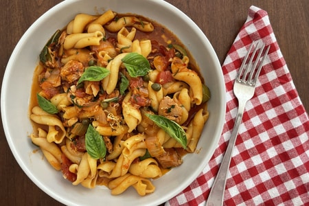 Pasta with canned tuna, olives, capers and tomatoes