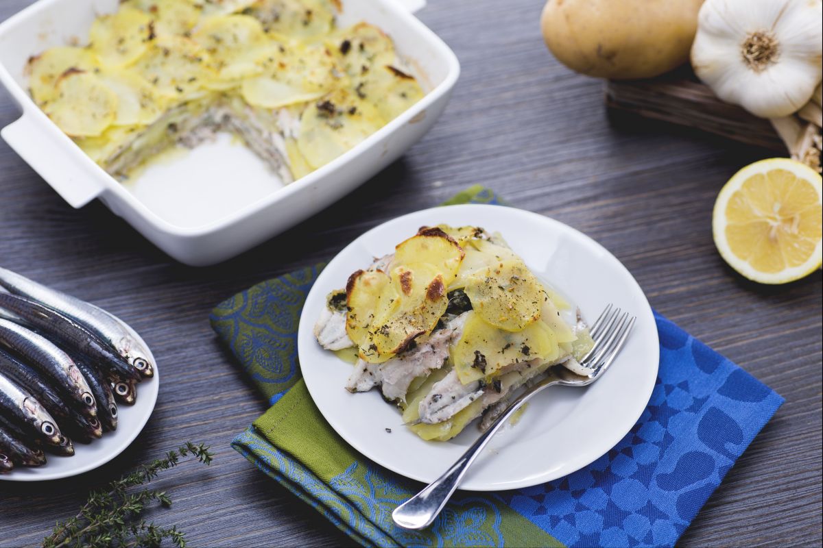 Baking dish of anchovies and potatoes