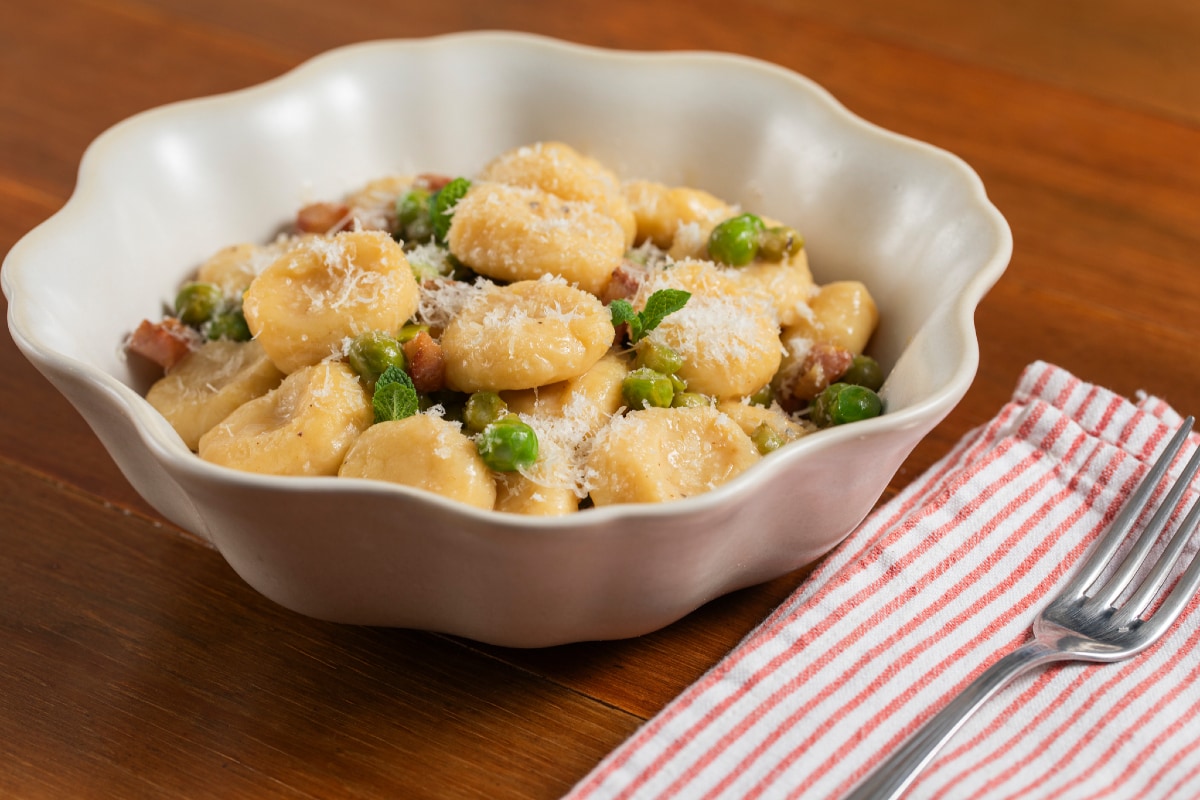Ricotta gnocchi with peas, pecorino, and guanciale