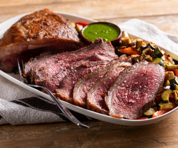 Oven-roasted picanha with vegetables and chimichurri sauce