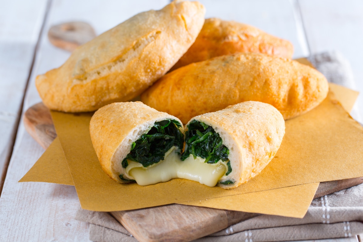 Mini calzones with tomino cheese and spinach