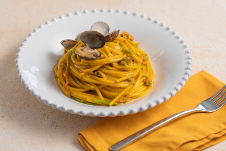Spaghetti with clams, zucchini flowers, and saffron