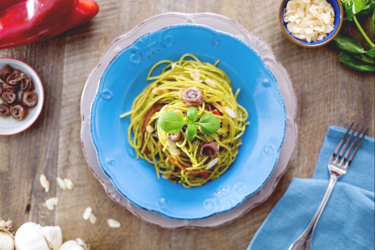 Spaghetti with pesto, anchovies, and peppers