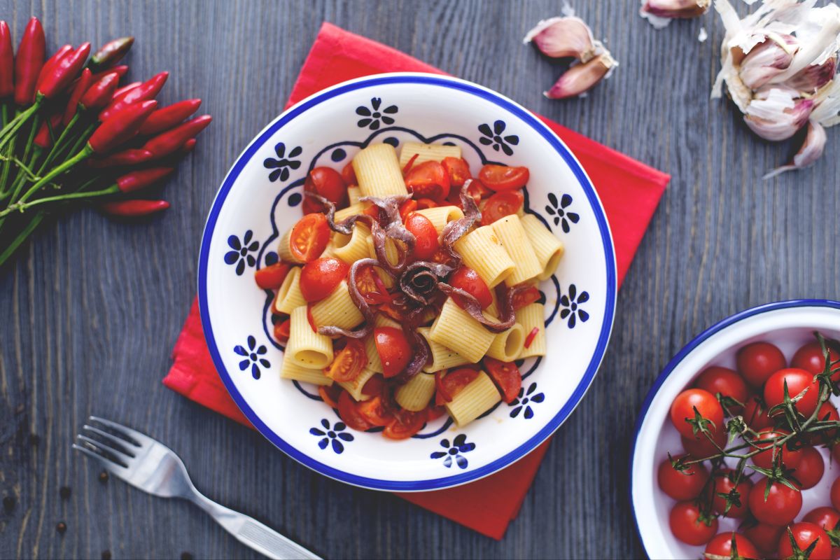 Mezze maniche with cherry tomatoes and anchovies