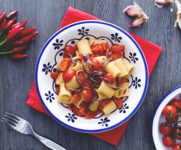 Mezze maniche with cherry tomatoes and anchovies