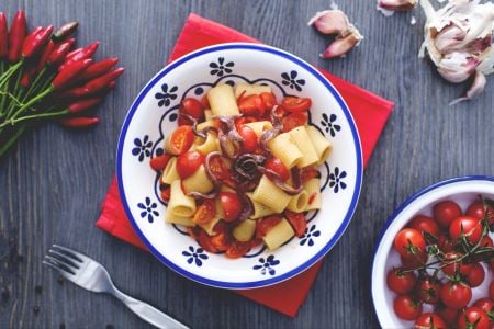 Mezze maniche with cherry tomatoes and anchovies