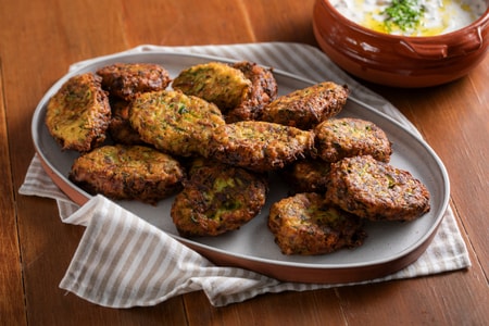 Zucchini and feta fritters with yogurt sauce