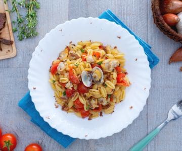 Malloreddus with clams, cherry tomatoes, and tuna bottarga