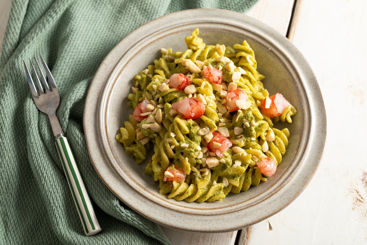 Pasta with zucchini and zucchini flower pesto with shrimp