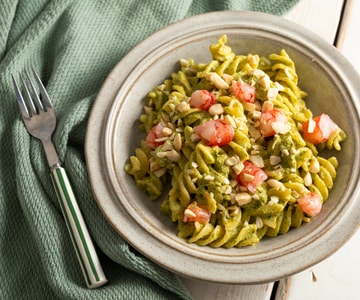 Pasta with zucchini and zucchini flower pesto with shrimp