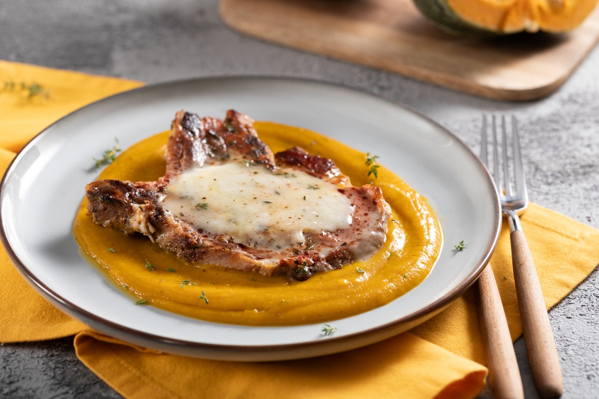 Pork chops with pumpkin cream and taleggio