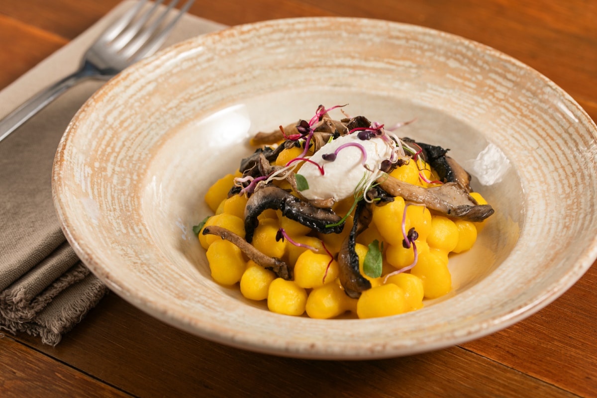 Gnocchi with pumpkin cream, mushrooms and ricotta