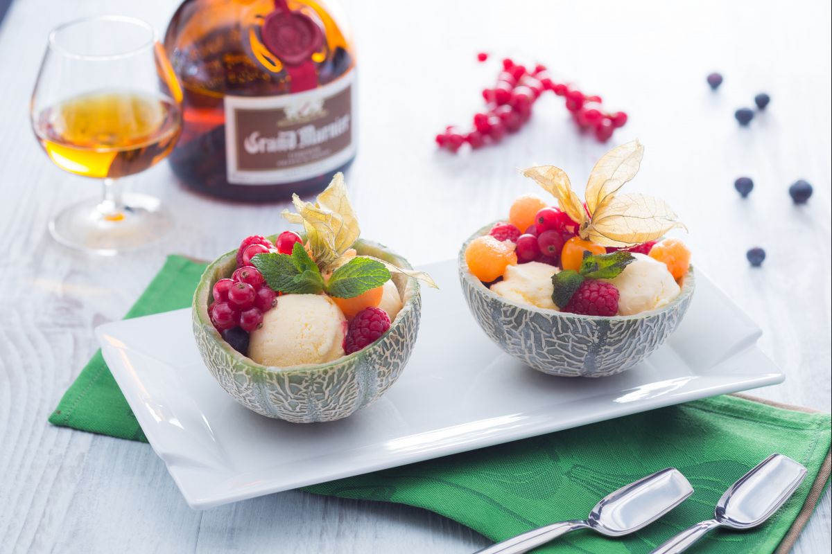 Melon filled with fruit and ice cream