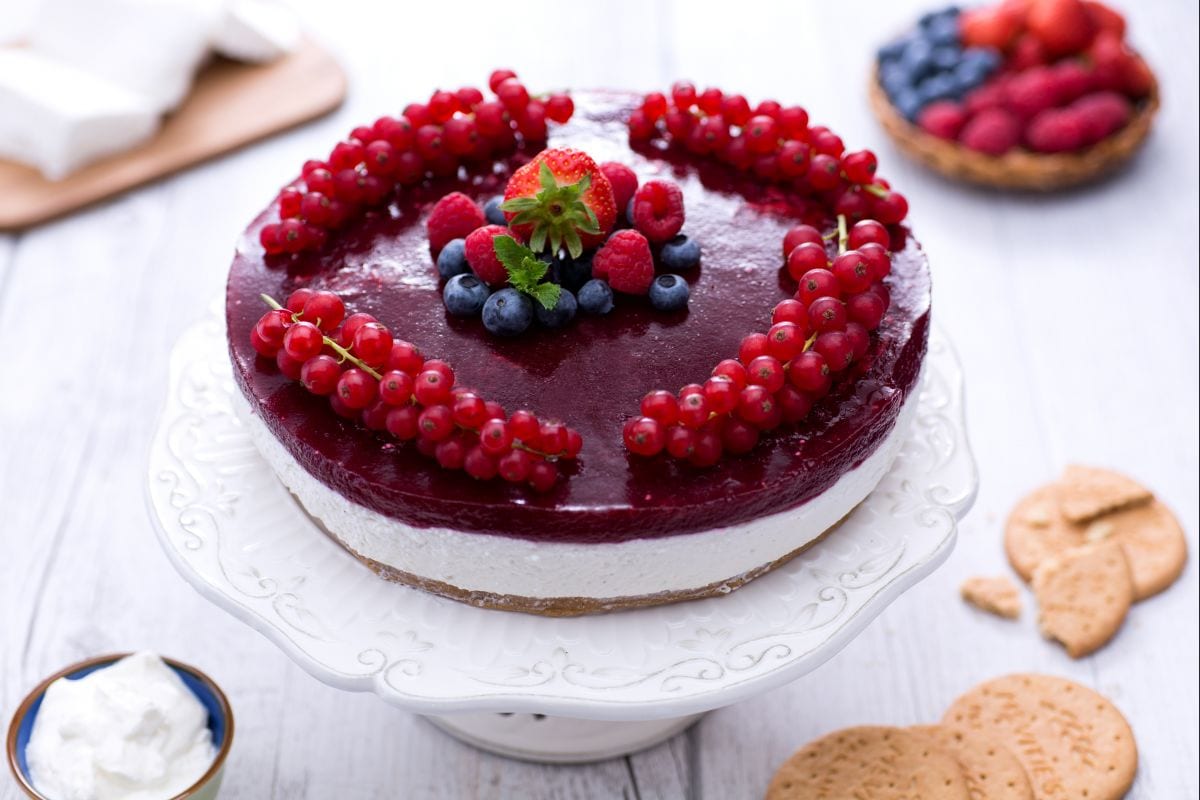 Yogurt cake with strawberry jelly and berries