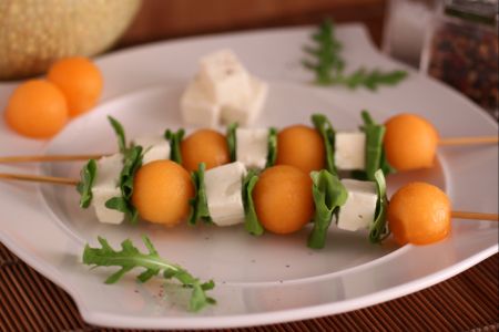 Melon, feta, and arugula skewers
