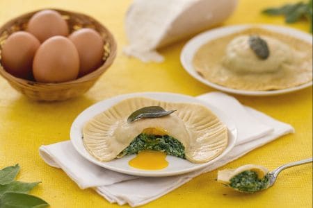 Large ravioli with molten yolk, ricotta, and spinach