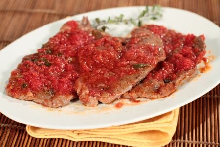 Slices with tomato, thyme, and marjoram