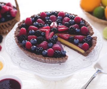 Cocoa tart with citrus curd and berry coulis