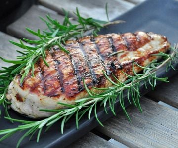 Chicken under a brick