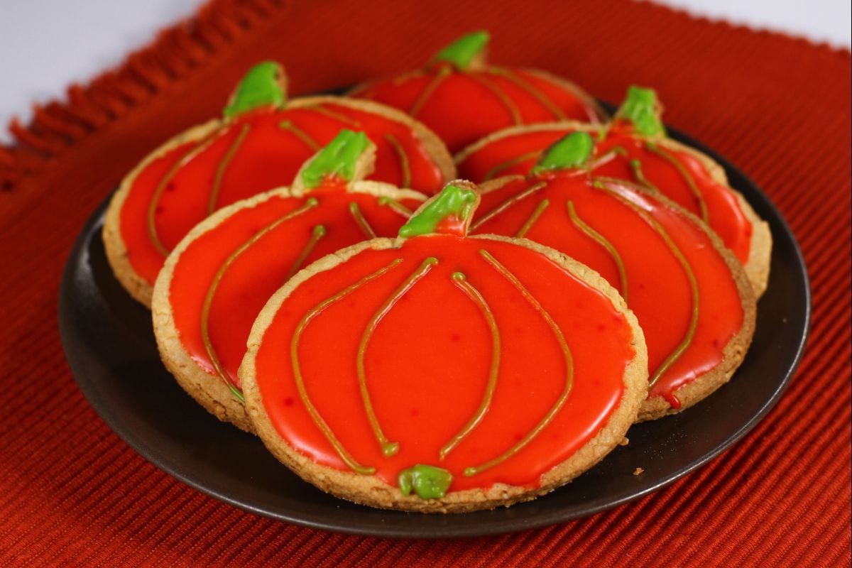 Pumpkin-shaped glazed cookies