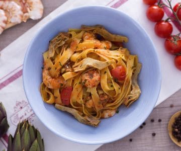 Fettuccine with artichokes and shrimp tails