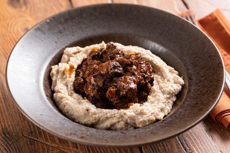 Wild boar stew with buckwheat polenta