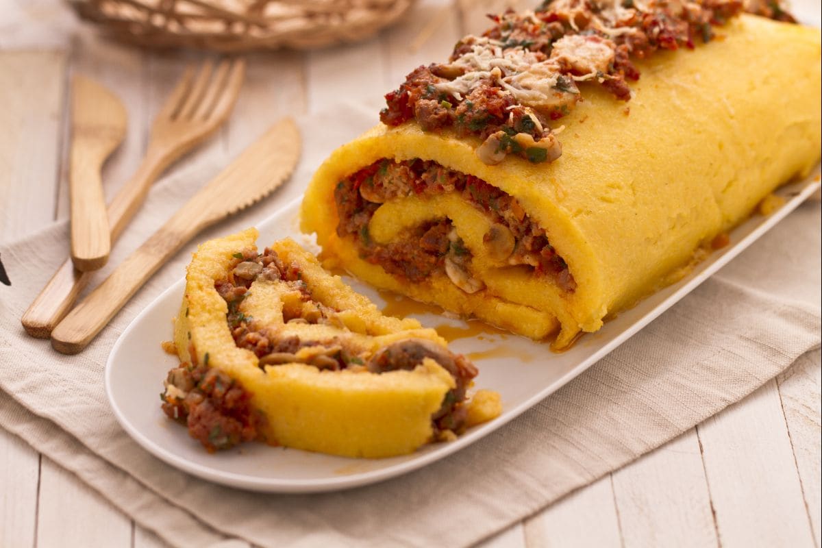 Polenta roll with sausage and mushrooms