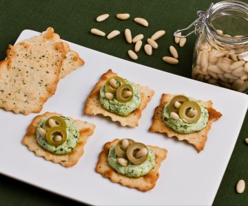 Olive puff pastries with pesto and ricotta
