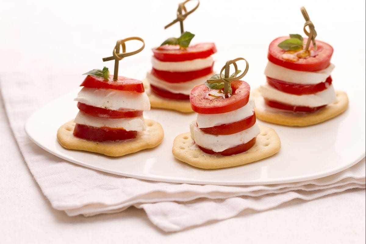 Caprese tower on crushed bread