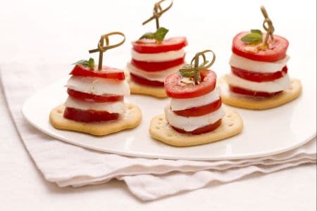 Caprese tower on crushed bread