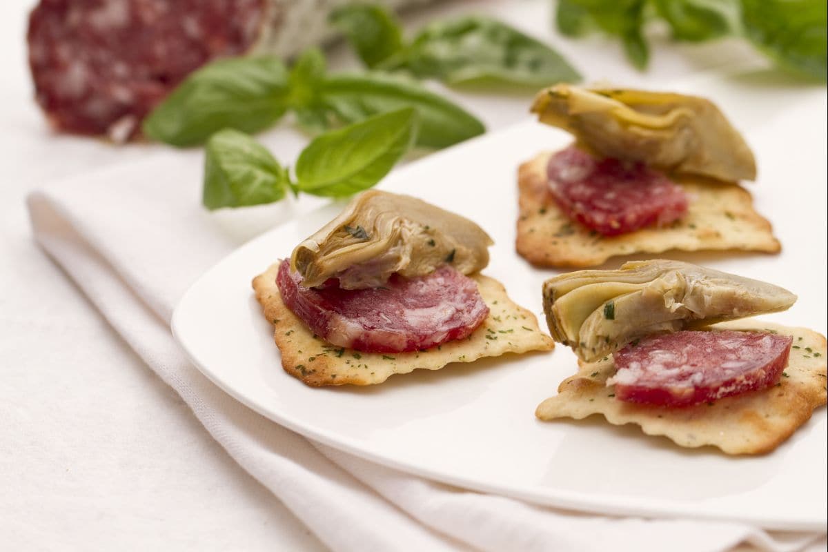 Artichokes and Salami on Olive Crackers