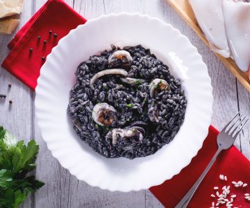 Squid ink risotto with shrimp