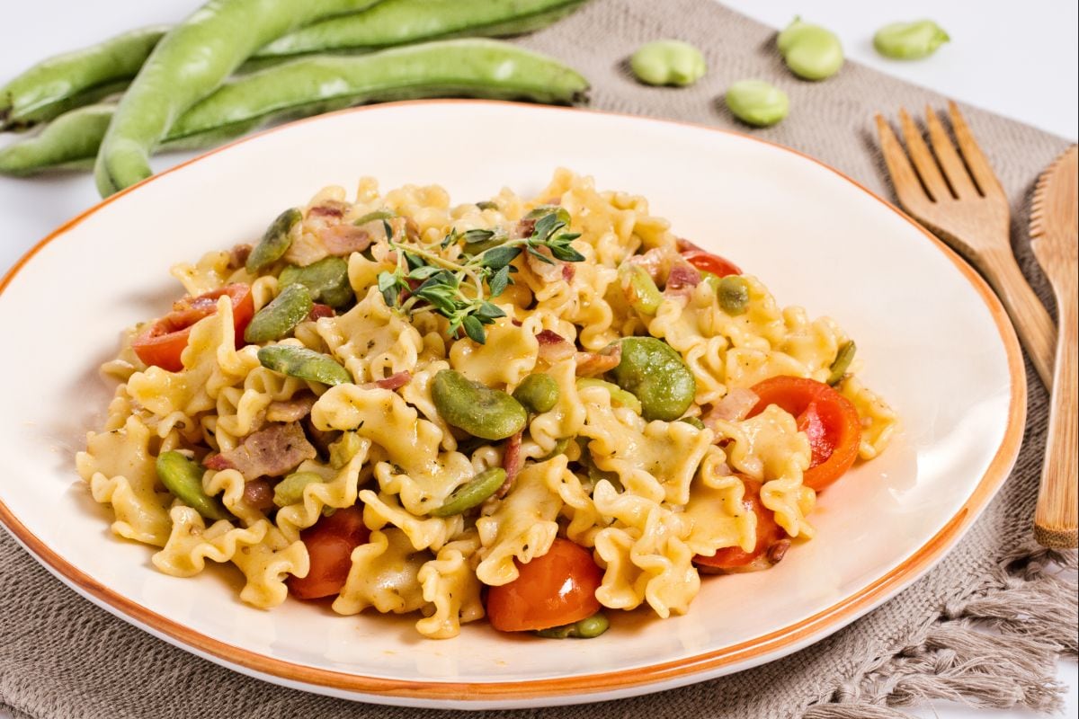 Pasta with fava beans, bacon, and cherry tomatoes