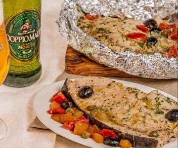 Beer-baked swordfish with cherry tomatoes and olives
