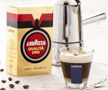 Orange coffee with creamy and aromatic milk foam