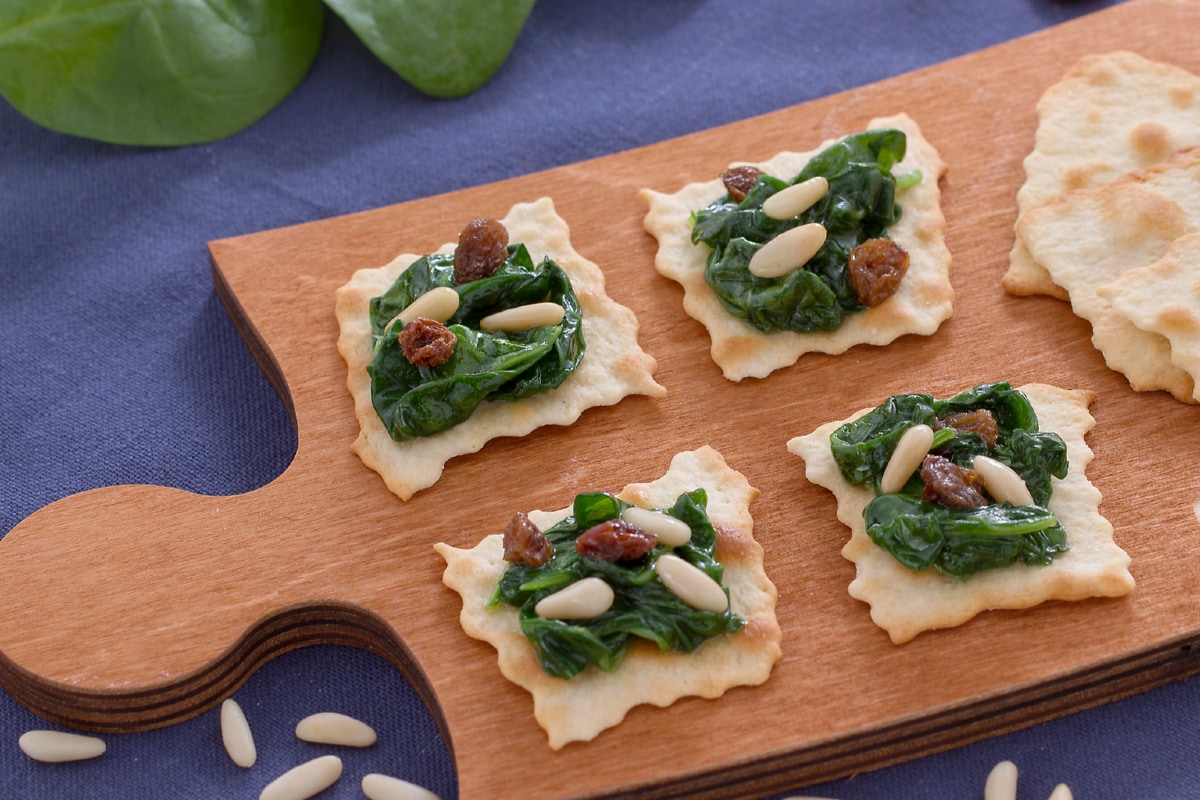 Classic puff pastries with spinach raisins and pine nuts