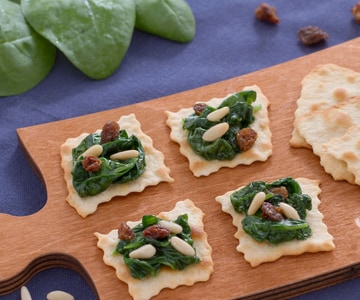 Classic puff pastries with spinach raisins and pine nuts