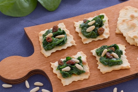 Classic puff pastries with spinach raisins and pine nuts