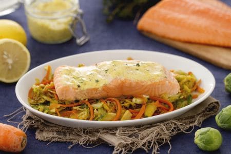 Salmon fillets on julienne of Brussels sprouts, leeks, and carrots